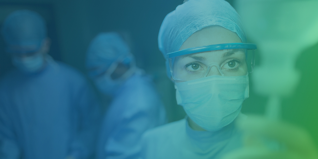 photo of medical professionals wearing surgical clothing