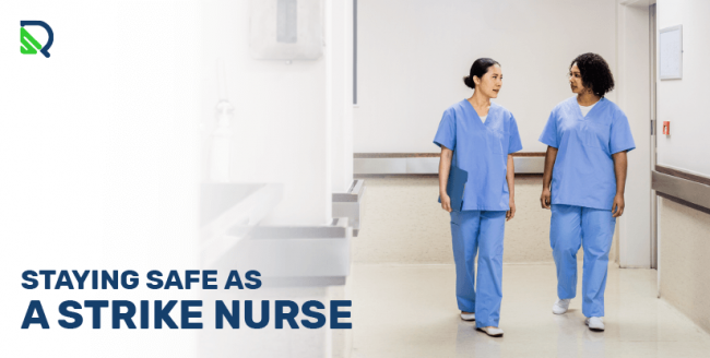 two clinicians walking down hallway of a medical facility